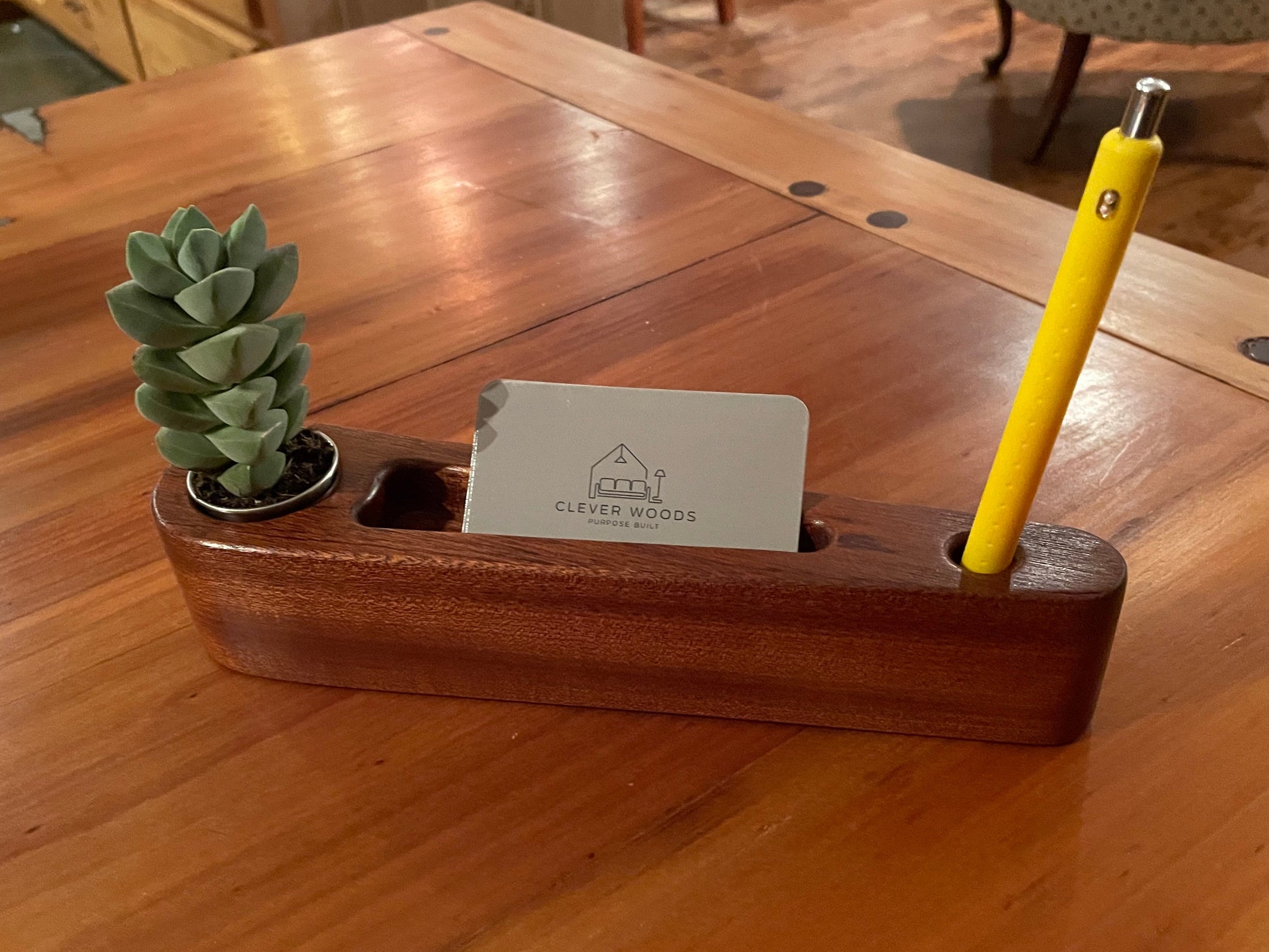 Solid sapele wood desk caddy with stainless planter cup, card slot, and pen holder